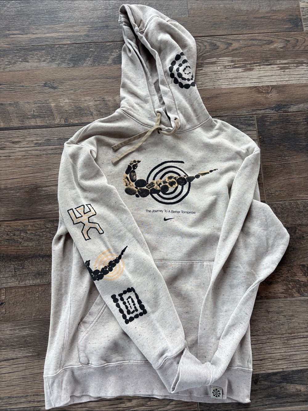 Nike Beige Graphic Pullover Hoodie with Black and Gold Accents
